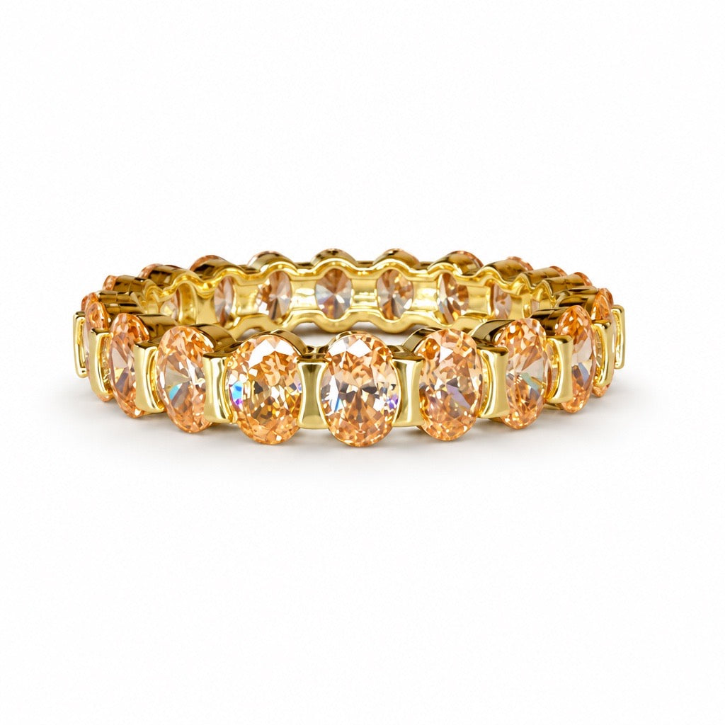 Champagne Tennis Band with oval-cut champagne colored CZ sstones in a gold-tone prong setting.