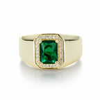 Gold ring with a green rectangular cubic zirconia stone surrounded with a halo of cubic zirconia clear stones