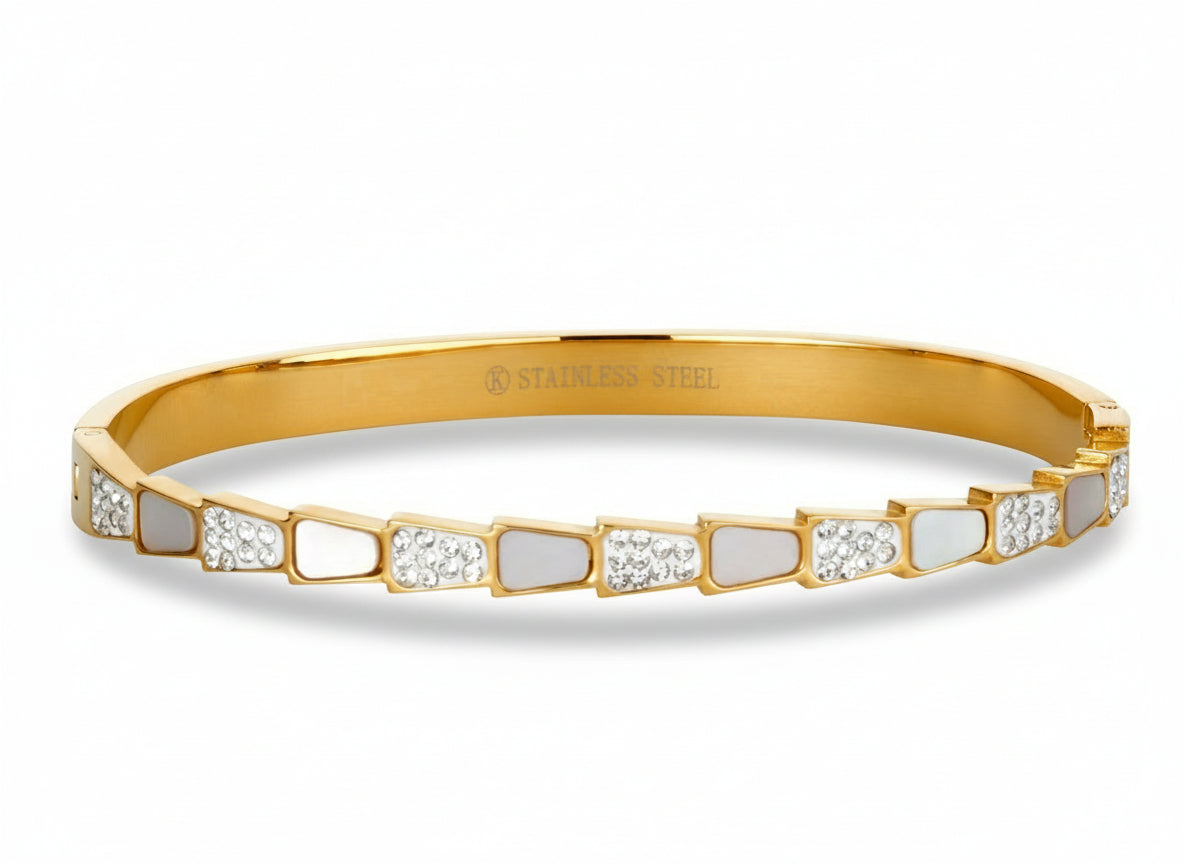 Gold-tone Sculpted Step bangle Bracelet in stainless steel with alternating mother-of-pearl and sparkling cubic zirconia accents.