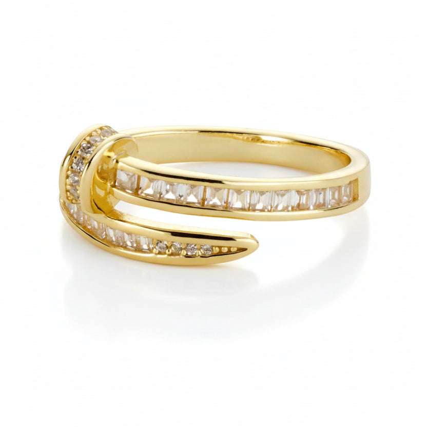 Gold-tone Nail Baguette Wrap Ring with channel-set baguette cubic zirconia stones and pavé cubic zirconia accents.