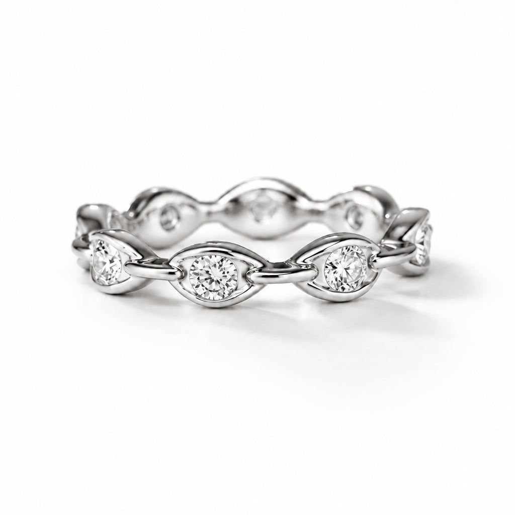 Silver-tone Round Moissanite Eternity Band featuring round-cut moissanite stones in sculpted marquise-shaped settings on a white background.