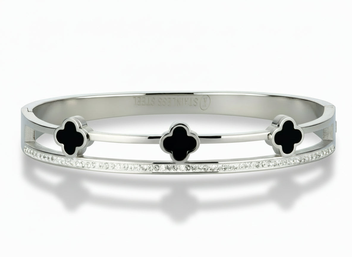 Silver-tone Onyx Clover Trio Bracelet with three onyx clovers and a row of sparkling cubic zirconia stones on a white background