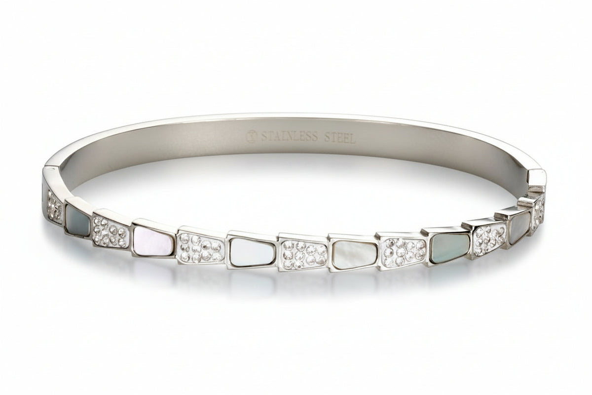 Silver-tone Sculpted Step bangle Bracelet in stainless steel with alternating mother-of-pearl and sparkling cubic zirconia accents.