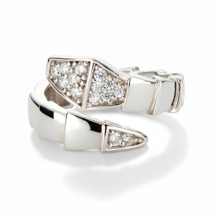 Silver-tone sculpted snake wrap ring with pavé cubic zirconia accents and a dimensional segmented design.